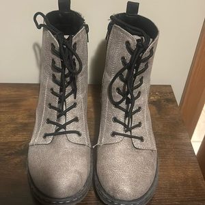 Gray combat boots.